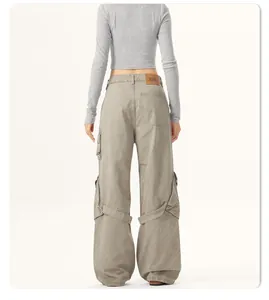Detail back view of vintage grey wide-leg cargo pants with pockets and tie design