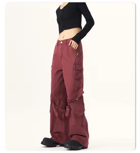 Detailed side view of burgundy American vintage wide-leg cargo pants with large pockets