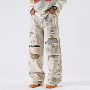Jean en denim premium style américain baggy pour hommes avec déchirures et coupe droite écru