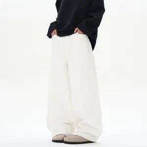 Jeans larghi curvi bianco albicocca unisex con dettagli di cuciture minimaliste