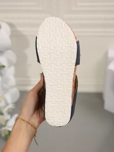 Detailed view of the anti-slip white foam sole for women's summer wedge slippers