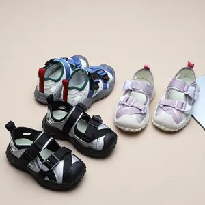 Close-up of breathable children's athletic sandals in multiple colors and mesh design.