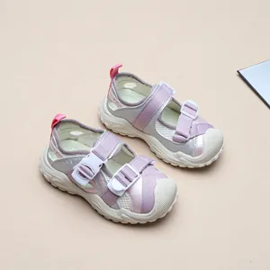 Macro view showing the breathable mesh and adjustable buckles of these kids' sports sandals
