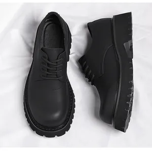 Top and side detail view of men's black matte leather derby shoes with chunky lug soles