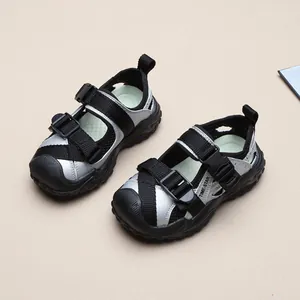 Detailed top-down view of children's closed-toe silver and black mesh sports sandals