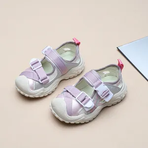 Close-up detail of children's breathable mesh sports sandals with closed-toe design.
