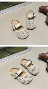 Detailed view of cream mesh breathable flat slippers for little girls with buckle straps
