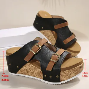 Stylish women's black wedge platform sandals with brown buckle straps and cork sole texture