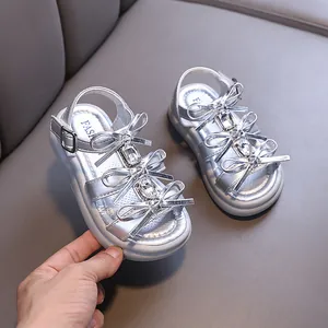 Elegant silver girls' princess sandals with sparkly crystal bow decorations for summer