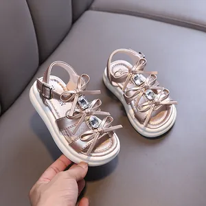 Elegant girls rose gold princess sandals with bow knots and rhinestone accents for summer