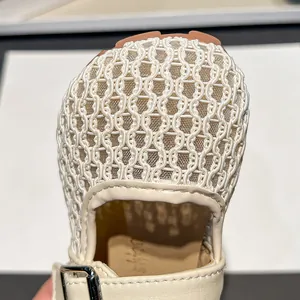 Detail view of children's breathable mesh closed-toe slippers with hollow pattern