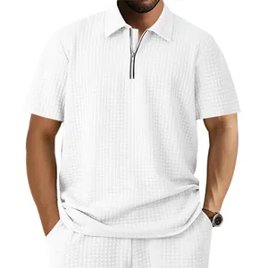 Close-up of men's white jacquard waffle knit polo shirt with zipper collar detail