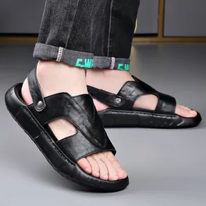 Casual black genuine leather sandals for men with breathable thick soles shown worn on feet