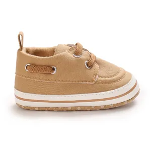 Detailed side view of khaki canvas baby walking shoes for infants aged 0 to 1 year