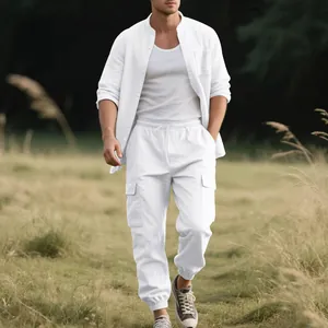 Detailed view of white men's linen two-piece set with stand-up collar and cargo pants.