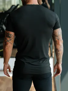 Detail showing back view of men's black slim fit athletic t-shirt for fitness and gym.