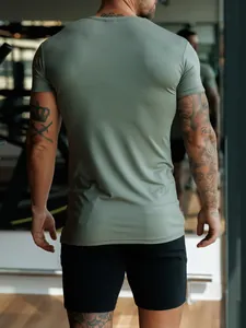 Men's olive green muscle fit performance gym t-shirt back view in fitness center