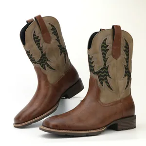 Detailed close-up showing the intricate embroidery and texture on vintage men's cowboy boots