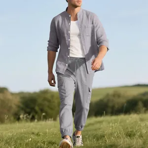 Men's loose linen set with stand collar shirt and cargo pants in a natural field