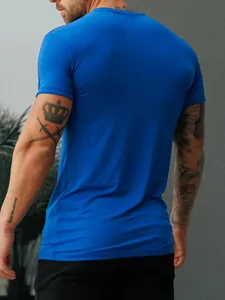 Back view of a slim fit blue athletic T-shirt for men, featuring stretch milk silk fabric