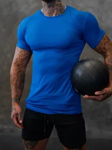 Close-up of blue men's athletic t-shirt showing high elasticity and professional fitness fit