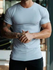 Detail view of men's stretch crew neck sports T-shirt in light blue for fitness and gym