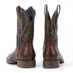 Rear view of brown men's vintage cowboy boots with intricate embroidery and hollow mesh details