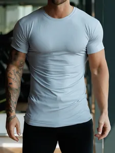Detailed close-up of men's slim-fit athletic t-shirt in breathable light blue fabric