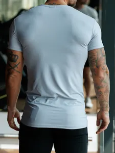 Detailed back view of men's slim fit athletic t-shirt in light blue stretch milk silk