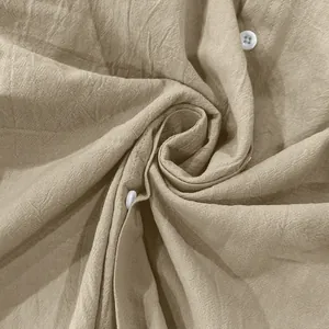 Macro view of high-quality beige linen fabric texture and white buttons for men's shirt
