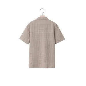 Detailed back view of heavy jacquard polo shirt featuring a textured grid pattern