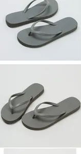 High-quality detail of stylish grey minimalist flip-flops for beach and summer wear.