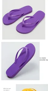 Detailed view of purple flip-flops showing the anti-slip diamond texture and strap.