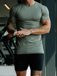 Athletic men's slim fit crew neck t-shirt in olive green for gym and fitness training.