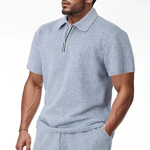 Detailed view of men's heavy jacquard knit polo shirt with quarter-zip collar design