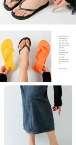 Detailed view of colorful summer flip-flops in yellow, orange, and black colors