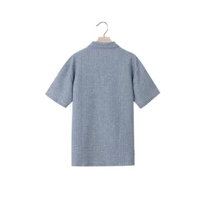 Back view of a men's loose fit grey jacquard polo shirt with waffle texture detail
