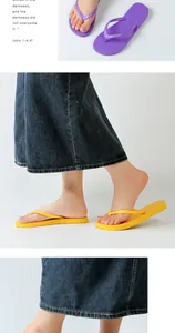 Side view of yellow fashion flip-flops worn with a denim skirt for summer beach style.
