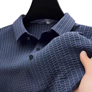 Polo da uomo blu navy in tessuto a nido d'ape per un look business casual raffinato