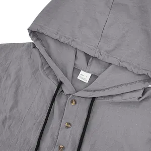 Close-up detail of gray linen-blend hooded Henley shirt showing buttons and texture