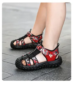 Close-up of boys' red camouflage closed-toe sports sandals with anti-slip soles