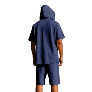 Back view of a men's navy blue linen hooded shirt and shorts summer beach set.