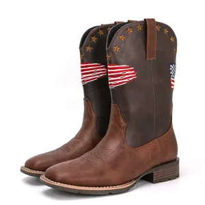 Detailed view of brown men's cowboy boots with American flag stars and stripes embroidery.