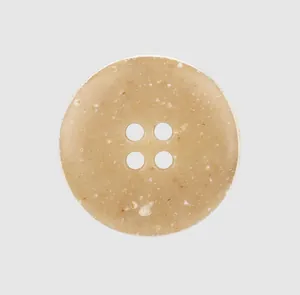 Macro detail view of a high-end four-hole urea button with natural organic speckled texture