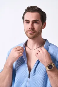 Close-up of blue jacquard texture and zipper on men's summer outdoor casual cardigan