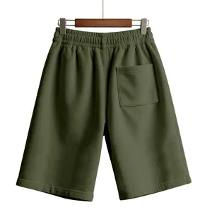 Back view of olive green corduroy shorts for men showing pocket and texture