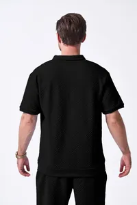 Back view of men's black jacquard short-sleeved leisure set showing fabric texture