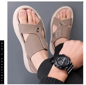 Detailed view of men's light brown beach sandals with soft non-slip soles.