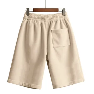 Detailed back view of beige men's corduroy shorts featuring elastic waist and pocket.