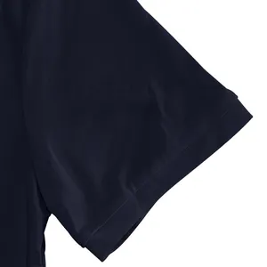 Detail view of quick-dry navy blue polo shirt sleeve showing piqué fabric texture